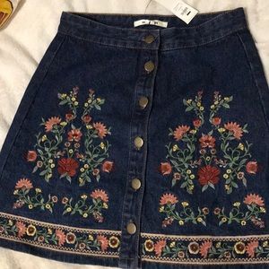 A beautiful flower patterned skirt never been worn